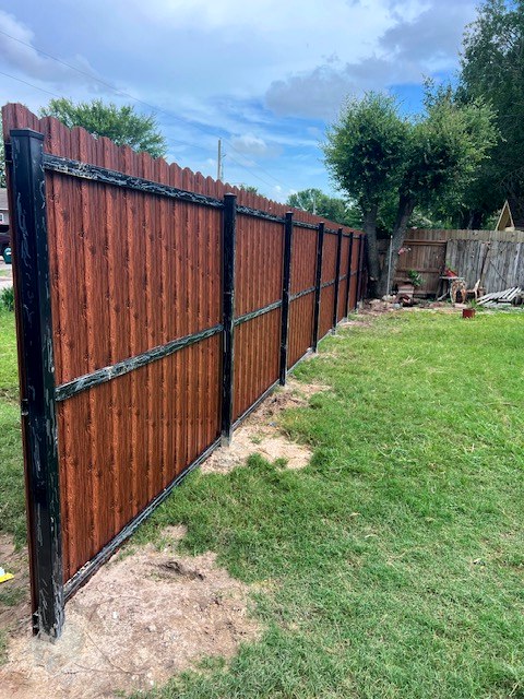 Finished wood-look metal fence with black frame